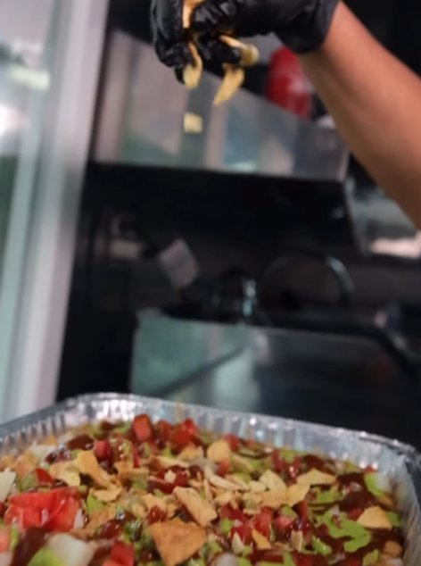 The Rollup team finishing a catering tray