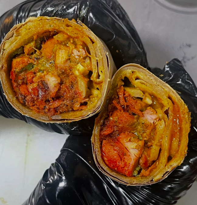 A freshly prepared Rollup roll cut in half